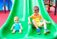 Vlad and Nikita play with Dolls on Outdoor playground 2